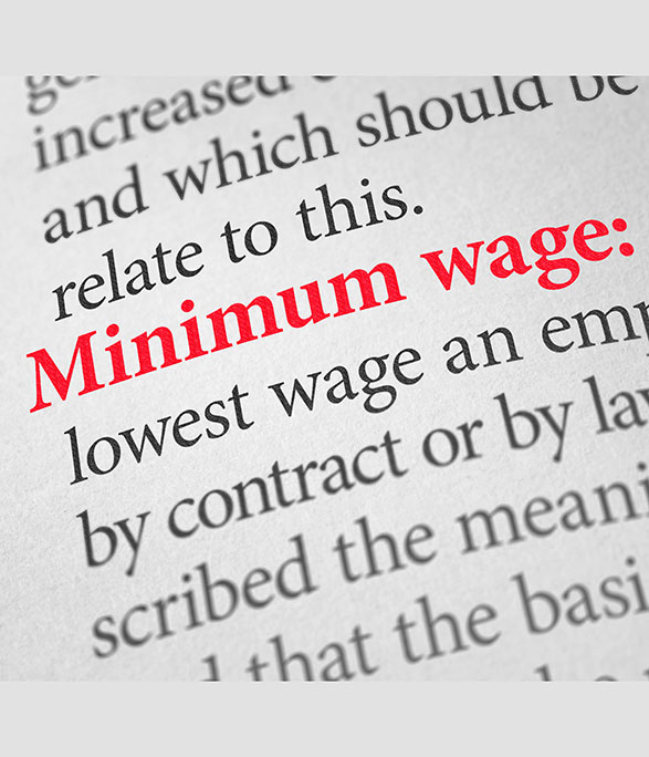 Definition of minimum wage highlighted in red on dictionary page